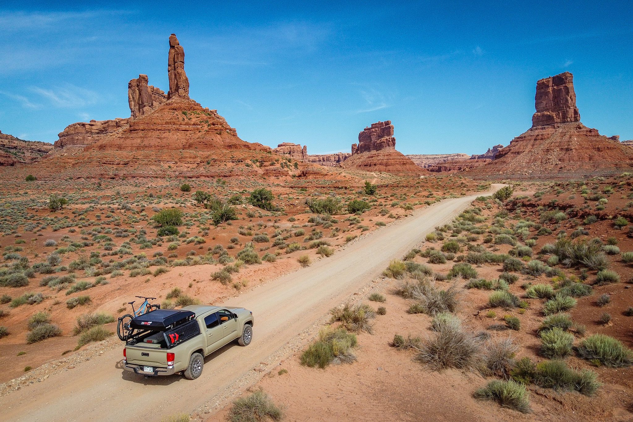 7 Reasons to go camping 23Zero tacoma in desert landscape with armadillo hardshell rooftop tent